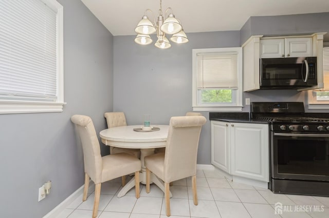 29 De Stefano Ave, Spotswood, NJ 08884 - dining space featuring a chandelier and light tile patterned floors