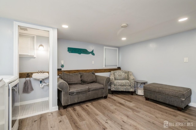 29 De Stefano Ave, Spotswood, NJ 08884 - living area featuring washing machine and dryer, wood finished floors, and recessed lighting
