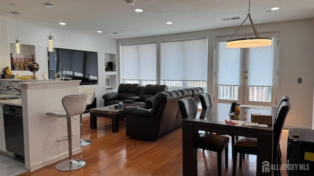 living room featuring recessed lighting and wood finished floors