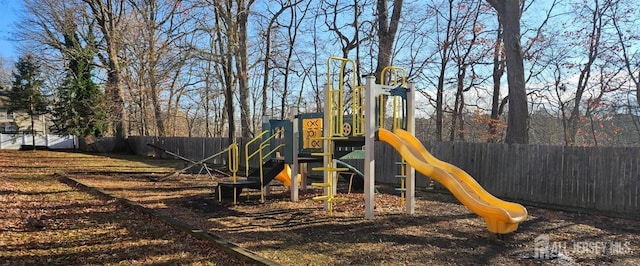 communal playground with a fenced backyard