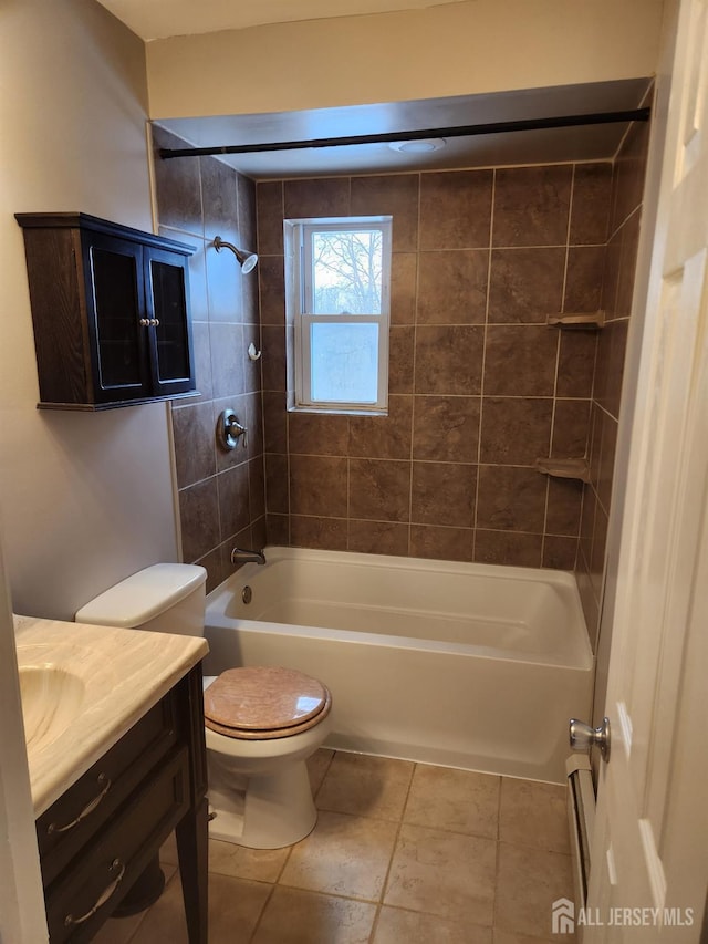 full bath featuring tile patterned flooring, bathing tub / shower combination, toilet, and vanity