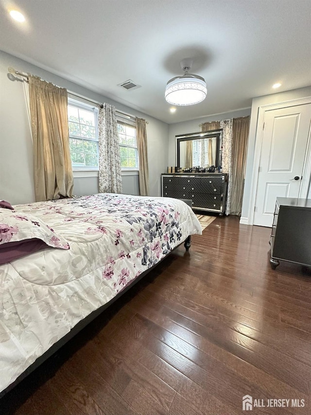 bedroom with recessed lighting, hardwood / wood-style flooring, and visible vents