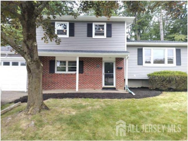 43 Barry Dr, Rockaway Twp, NJ 07866 - view of front of home featuring a front lawn, a garage, and brick siding