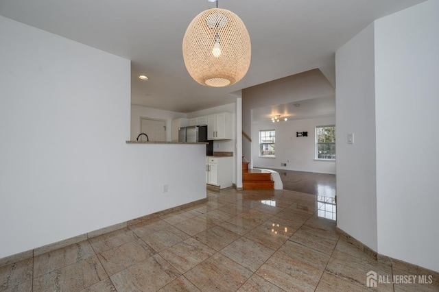 interior space featuring recessed lighting, stairway, and baseboards