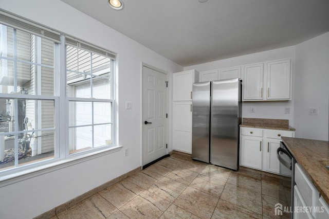 kitchen with baseboards, recessed lighting, freestanding refrigerator, dishwasher, and white cabinetry