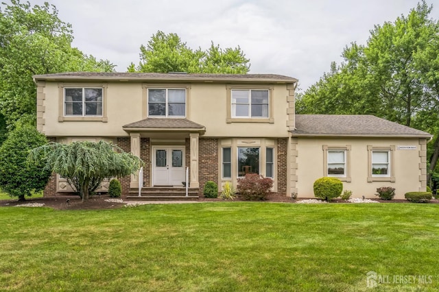 14 Greensview Dr, Scotch Plains, NJ 07076 - view of front of house featuring a front lawn, stucco siding, and brick siding