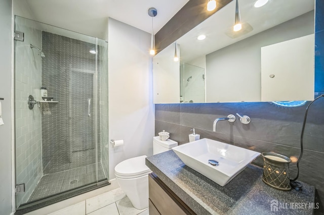 14 Greensview Dr, Scotch Plains, NJ 07076 - bathroom featuring a stall shower, vanity, tile walls, and tile patterned floors