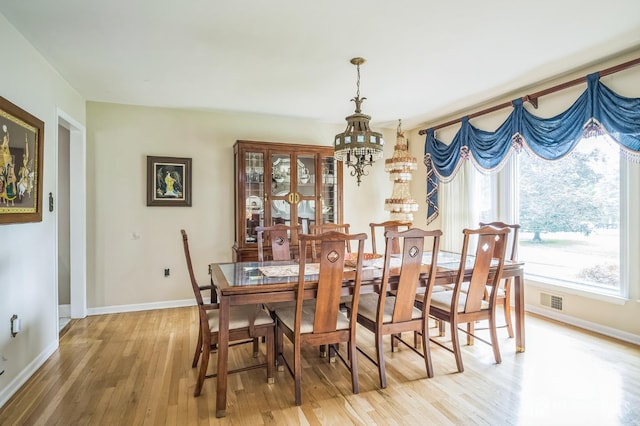 14 Greensview Dr, Scotch Plains, NJ 07076 - dining space with a chandelier and light wood finished floors