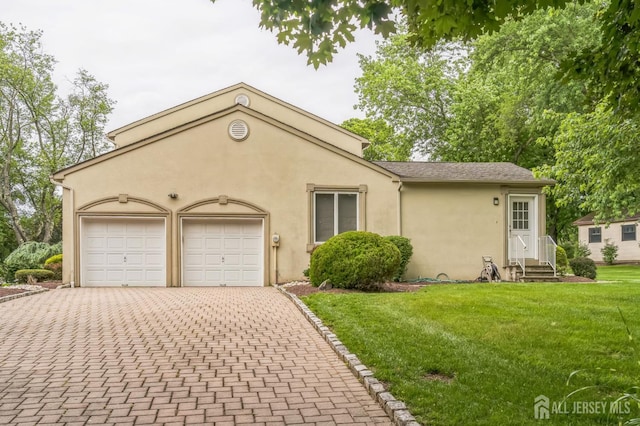 14 Greensview Dr, Scotch Plains, NJ 07076 - view of front facade with entry steps, decorative driveway, a garage, stucco siding, and a front lawn