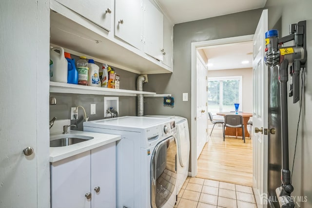 14 Greensview Dr, Scotch Plains, NJ 07076 - laundry room with cabinet space, washing machine and dryer, and light tile patterned floors