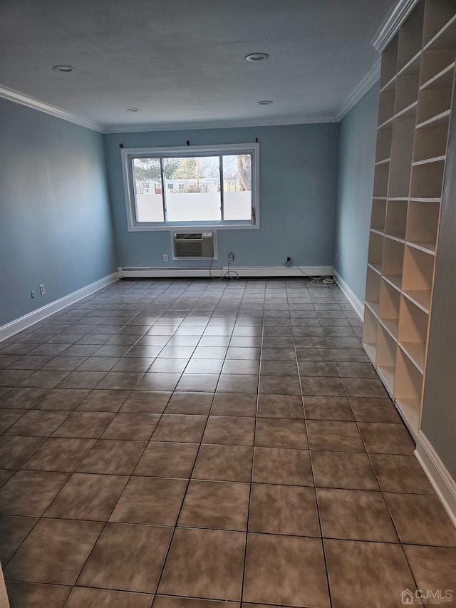 spare room featuring dark tile patterned flooring, crown molding, and a wall mounted AC