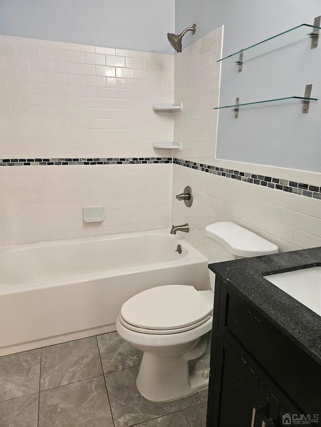 full bath with bathtub / shower combination, tile walls, toilet, and vanity