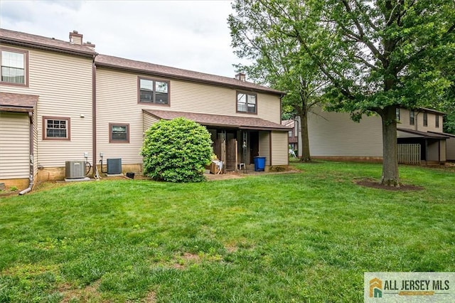 7402 Hana Rd, Edison, NJ 08817 - back of property with a lawn and a chimney