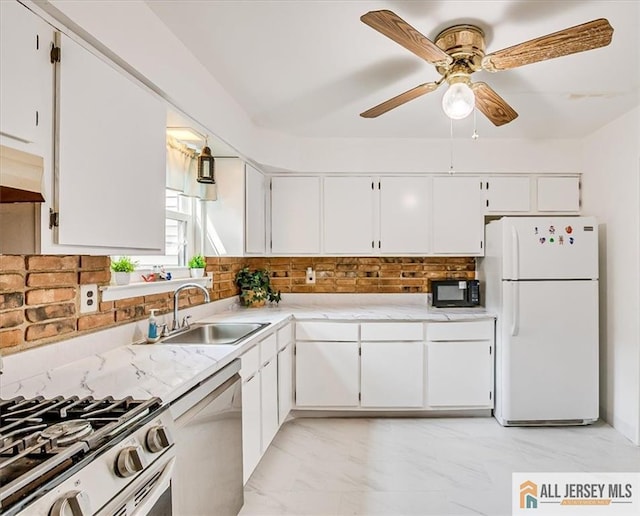 7402 Hana Rd, Edison, NJ 08817 - kitchen featuring freestanding refrigerator, dishwashing machine, stainless steel gas stove, a ceiling fan, and light marble finish floors