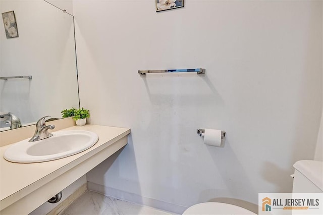 7402 Hana Rd, Edison, NJ 08817 - half bath with vanity and marble look tile flooring
