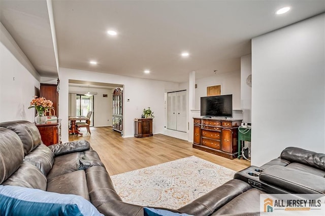7402 Hana Rd, Edison, NJ 08817 - living area with light wood finished floors and recessed lighting