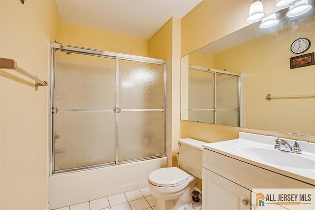 7402 Hana Rd, Edison, NJ 08817 - bathroom with vanity, enclosed tub / shower combo, and tile patterned flooring