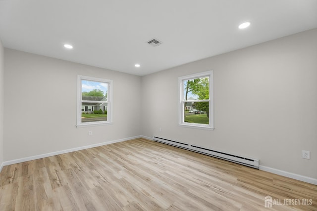 381-C Old Nassau Rd, Monroe, NJ 08831 - unfurnished room featuring a baseboard radiator, wood finished floors, and recessed lighting