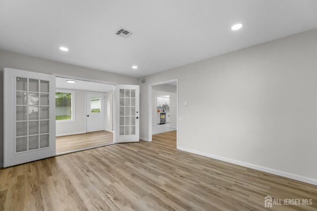 381-C Old Nassau Rd, Monroe, NJ 08831 - empty room with french doors, wood finished floors, and recessed lighting