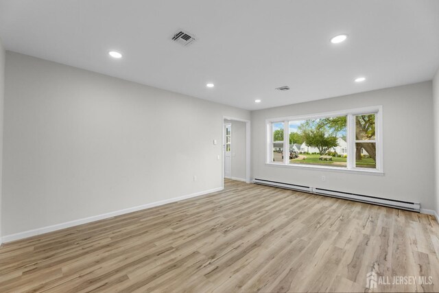 381-C Old Nassau Rd, Monroe, NJ 08831 - empty room featuring baseboard heating, light wood finished floors, and recessed lighting