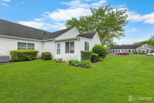 381-C Old Nassau Rd, Monroe, NJ 08831 - view of side of home with a lawn and a shingled roof