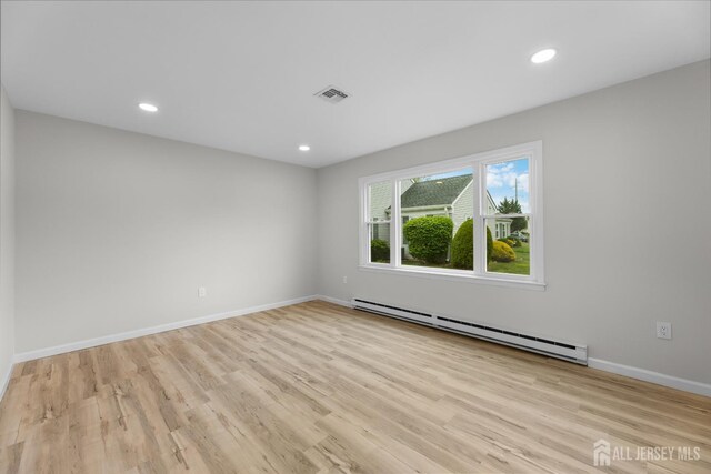 381-C Old Nassau Rd, Monroe, NJ 08831 - spare room featuring a baseboard radiator, light wood-style floors, and recessed lighting