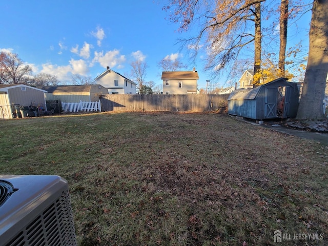 view of yard with a storage unit and central AC unit