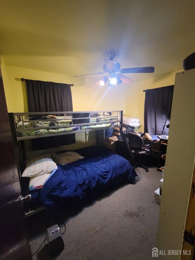 carpeted bedroom featuring ceiling fan