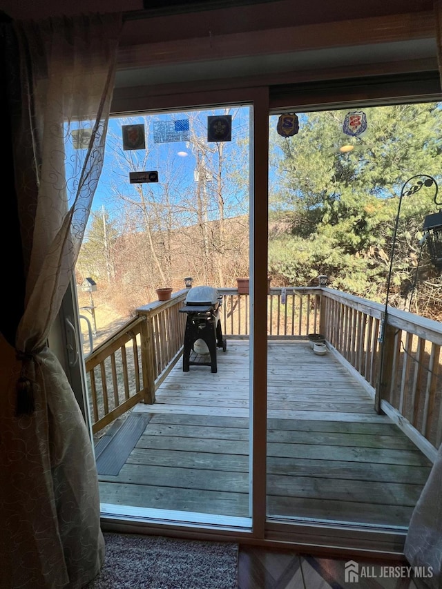 wooden deck featuring grilling area