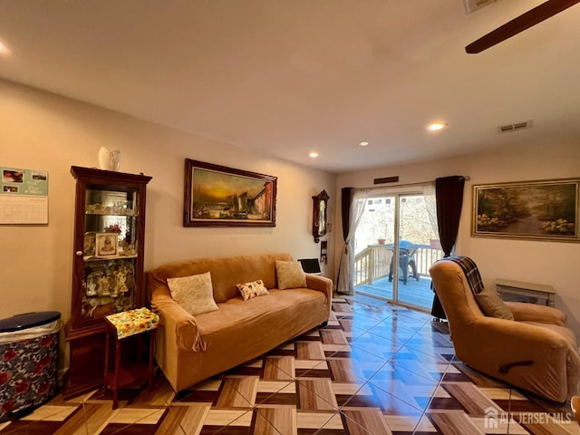 living room with recessed lighting and visible vents