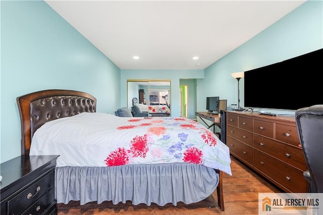 bedroom featuring a closet and dark hardwood / wood-style floors