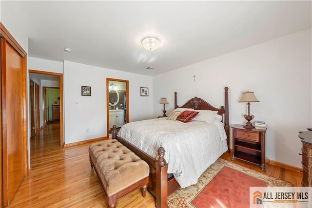 bedroom with light wood-type flooring, baseboards, and visible vents