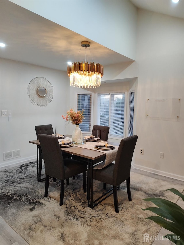 dining area featuring a chandelier