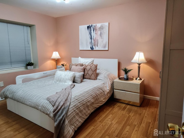 bedroom with light hardwood / wood-style floors