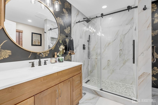 full bath with vanity, recessed lighting, marble finish floor, and a marble finish shower