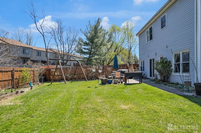 view of yard with a fenced backyard and a patio area
