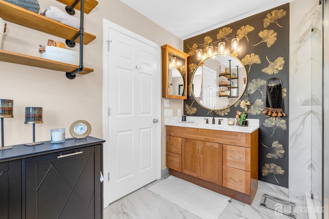bathroom featuring marble finish floor and vanity