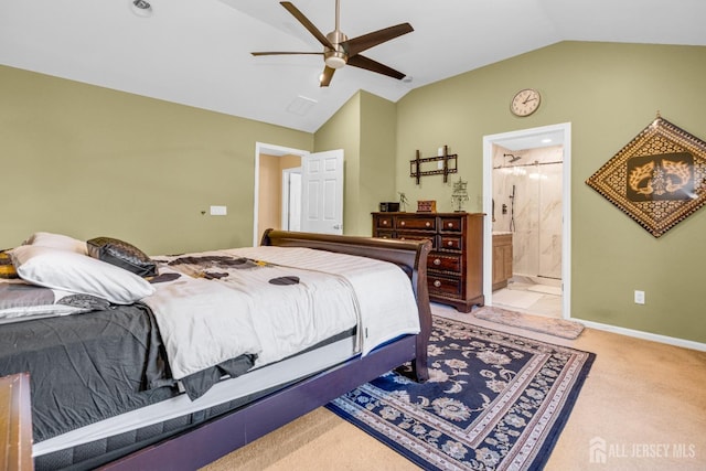 bedroom featuring ceiling fan, baseboards, lofted ceiling, ensuite bathroom, and carpet flooring