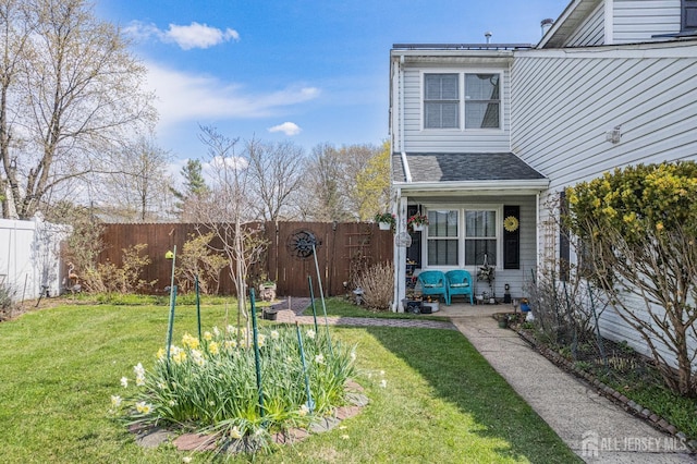 view of yard with a fenced backyard