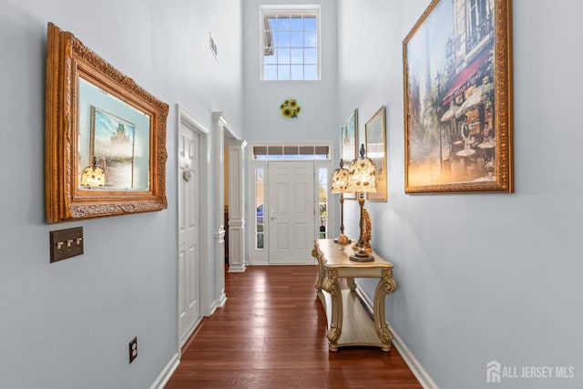 31 Mcgowan Ct, Old Bridge, NJ 08857 - foyer featuring dark wood finished floors, ornate columns, and a towering ceiling