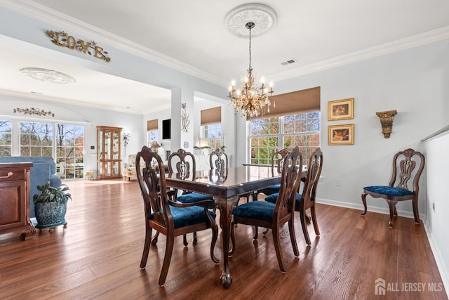31 Mcgowan Ct, Old Bridge, NJ 08857 - dining area featuring a chandelier, dark wood finished floors, and crown molding
