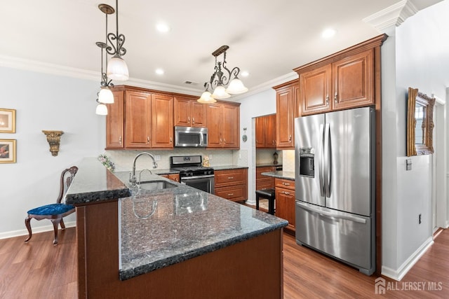31 Mcgowan Ct, Old Bridge, NJ 08857 - kitchen featuring appliances with stainless steel finishes, brown cabinetry, ornamental molding, tasteful backsplash, and dark wood-style floors