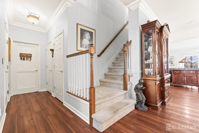 31 Mcgowan Ct, Old Bridge, NJ 08857 - entryway with dark wood finished floors, stairs, and ornamental molding