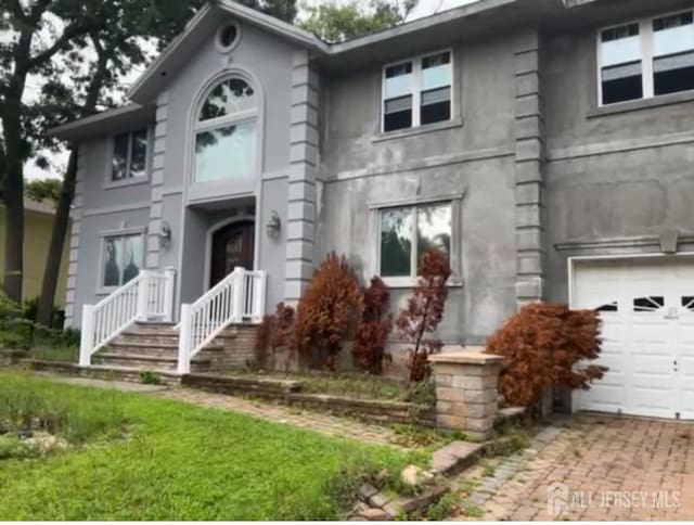 1948 Pine Meadow Ave, Toms River, NJ 08753 - view of front of property with an attached garage and decorative driveway