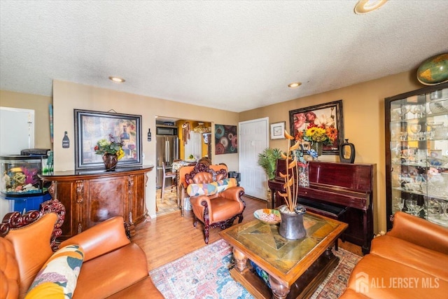 19 Pembrook Ave, North Brunswick, NJ 08902 - living room with wood finished floors, a textured ceiling, and recessed lighting
