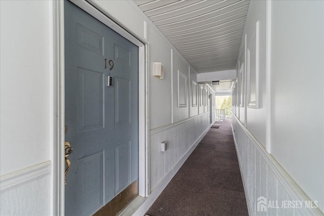 19 Pembrook Ave, North Brunswick, NJ 08902 - corridor featuring a wainscoted wall and carpet