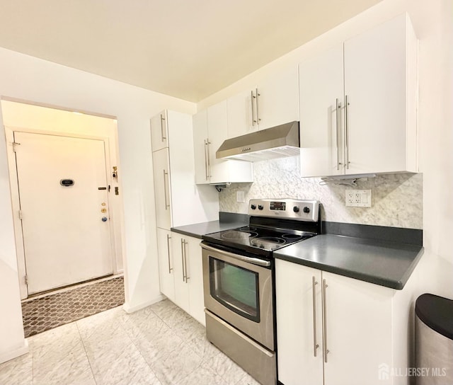 54 Amberly Dr Unit A, Manalapan, NJ 07726 - kitchen with stainless steel range with electric stovetop, under cabinet range hood, dark countertops, and backsplash