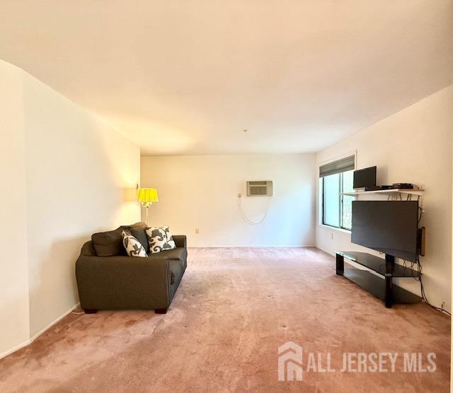 54 Amberly Dr Unit A, Manalapan, NJ 07726 - carpeted living room featuring a wall mounted AC