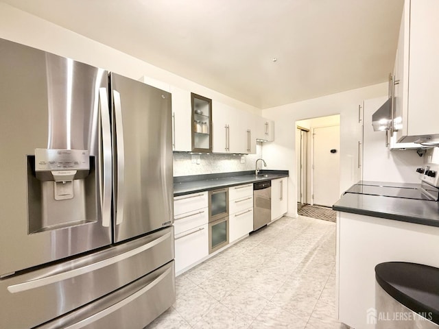 54 Amberly Dr Unit A, Manalapan, NJ 07726 - kitchen featuring appliances with stainless steel finishes, dark countertops, and white cabinetry