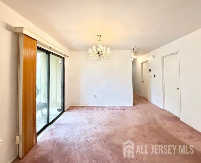 54 Amberly Dr Unit A, Manalapan, NJ 07726 - empty room featuring light carpet and a chandelier